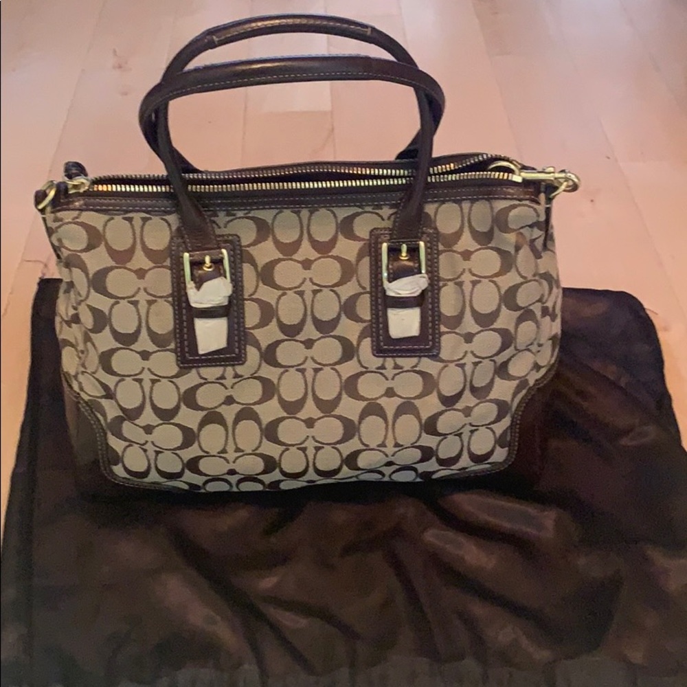 Coach handbag NWOT. Shoulder strap and care bag